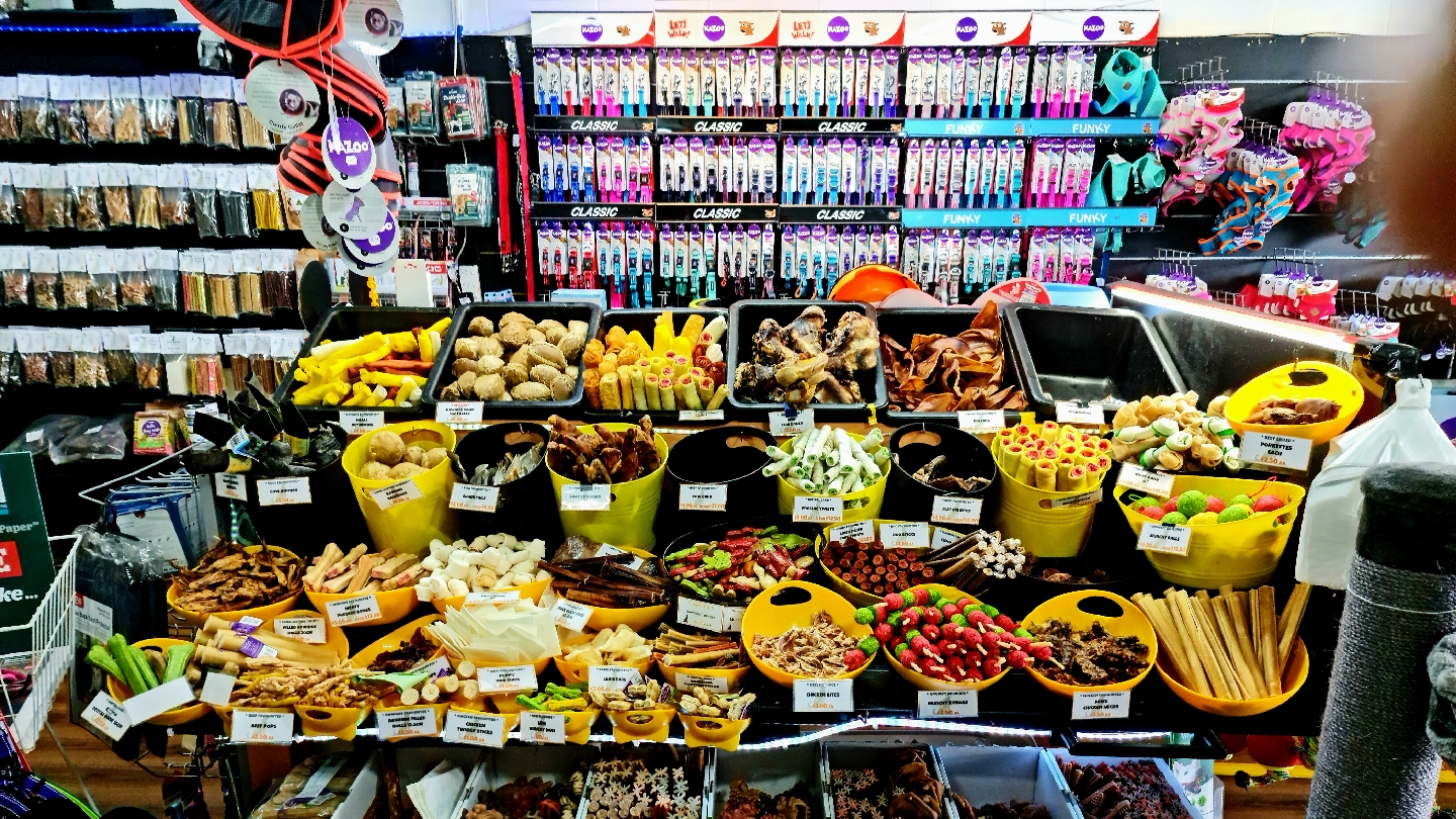 Bowls of natural chews and dried treats on the treat bar