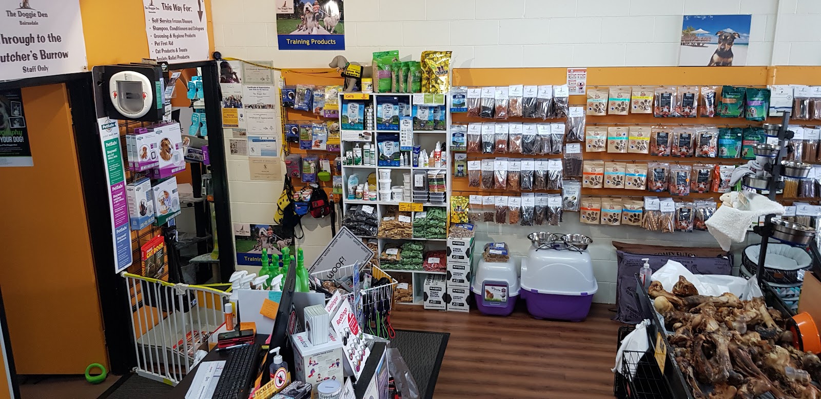 Inside the shop, with shelves of treats and products